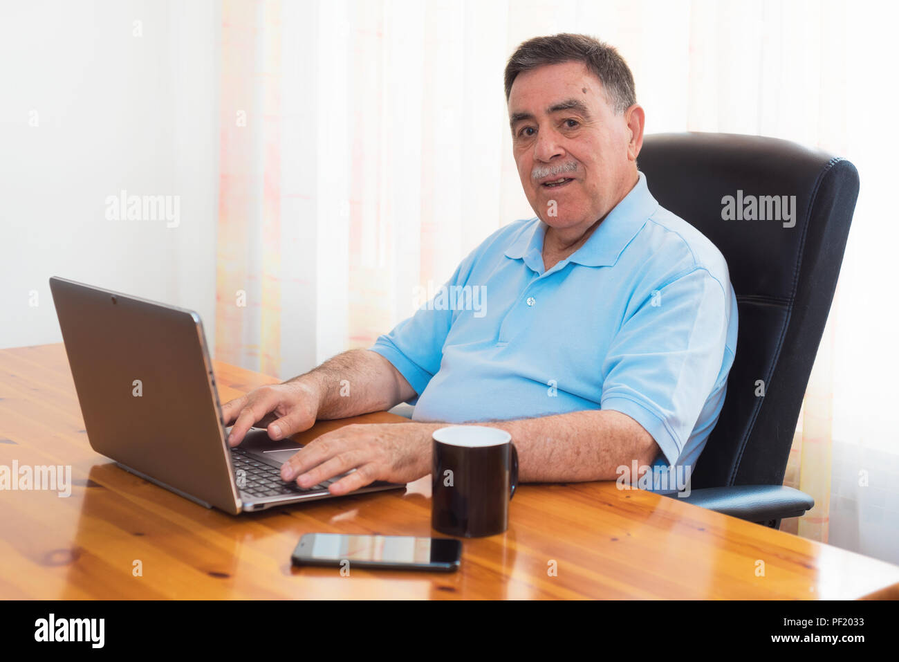 Portrait senior man typing hi-res stock photography and images - Alamy