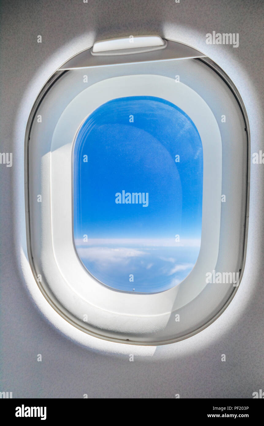 Blue sky from the airplane window Stock Photo