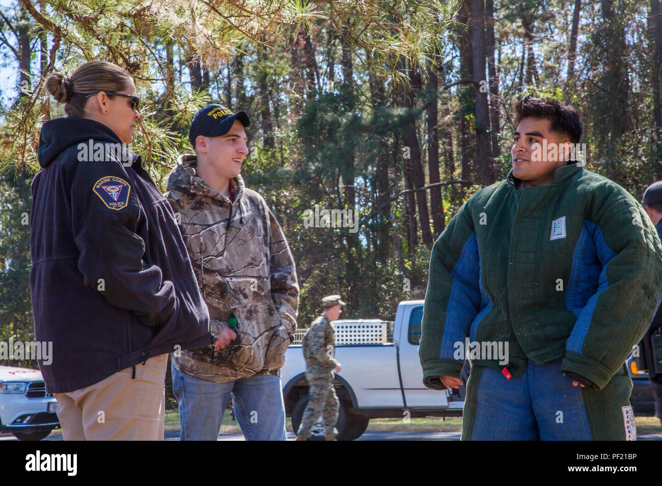 Timothy Rhodes speaks with members of the Provost Marshal's Office ...