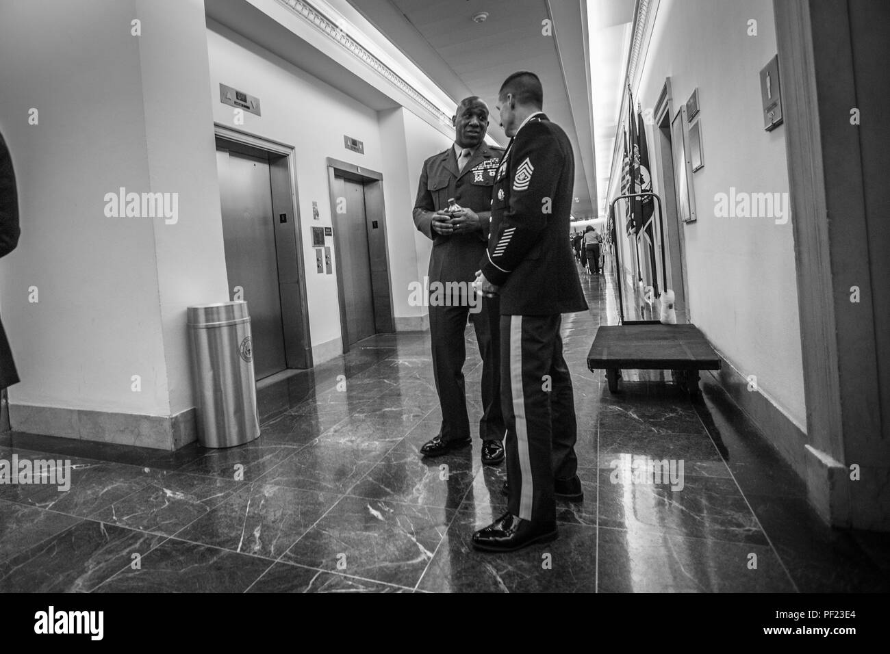 The 18th Sergeant Major of the Marine Corps, Ronald L. Green, speaks with members of the Committee on Appropriations, Military Construction, U.S. House of Representatives, at Capitol Hill, Washington D.C., Feb. 23, 2016. Sgt. Maj. Green was making final preparations prior to his testimony on the quality of life within the Marine Corps. (U.S. Marine Corps photo by Sgt. Melissa Marnell, Office of the Sergeant Major of the Marine Corps/Released) Stock Photo