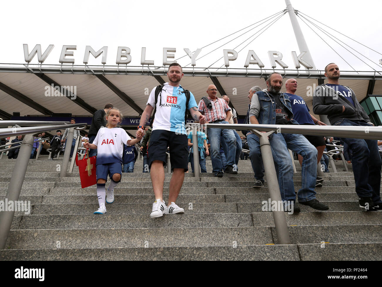 Tottenham Hotspur fans arriving to the ground before the Premier League match at Wembley Stadium, London. PRESS ASSOCIATION Photo. Picture date: Saturday August 18, 2018. See PA story SOCCER Tottenham. Photo credit should read: Nick Potts/PA Wire. RESTRICTIONS: No use with unauthorised audio, video, data, fixture lists, club/league logos or 'live' services. Online in-match use limited to 120 images, no video emulation. No use in betting, games or single club/league/player publications. Stock Photo
