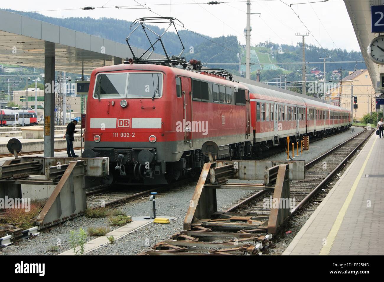 DB 111-002-2 waits at Innsbruck Hauptbahnhof for its next service, Tirol Austria Stock Photo