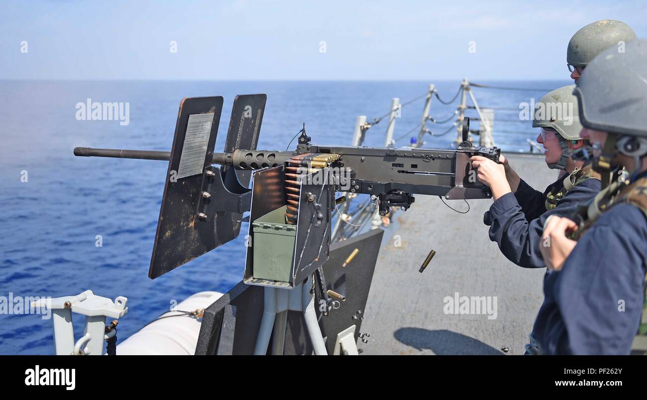160228-N-KM939-204 PHILIPPINE SEA (Feb. 28, 2016) - Gunner’s Mate Seaman Ashley Koblitz, from Jacksonville, fires a .50-caliber machine gun during a small craft action team exercise aboard the guided-missile destroyer USS Stockdale (DDG 106). Providing a ready force supporting security and stability in the Indo-Asia-Pacific, Stockdale is operating as part of the John C. Stennis Strike Group and Great Green Fleet on a regularly scheduled 7th Fleet deployment. (U.S. Navy photo by Mass Communication Specialist 3rd Class David A. Cox/Released) Stock Photo