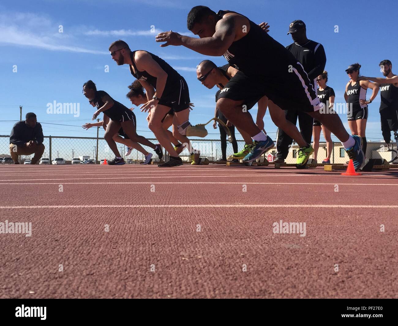 U.S. Army athletes practice block start drills at Stout Track, Fort