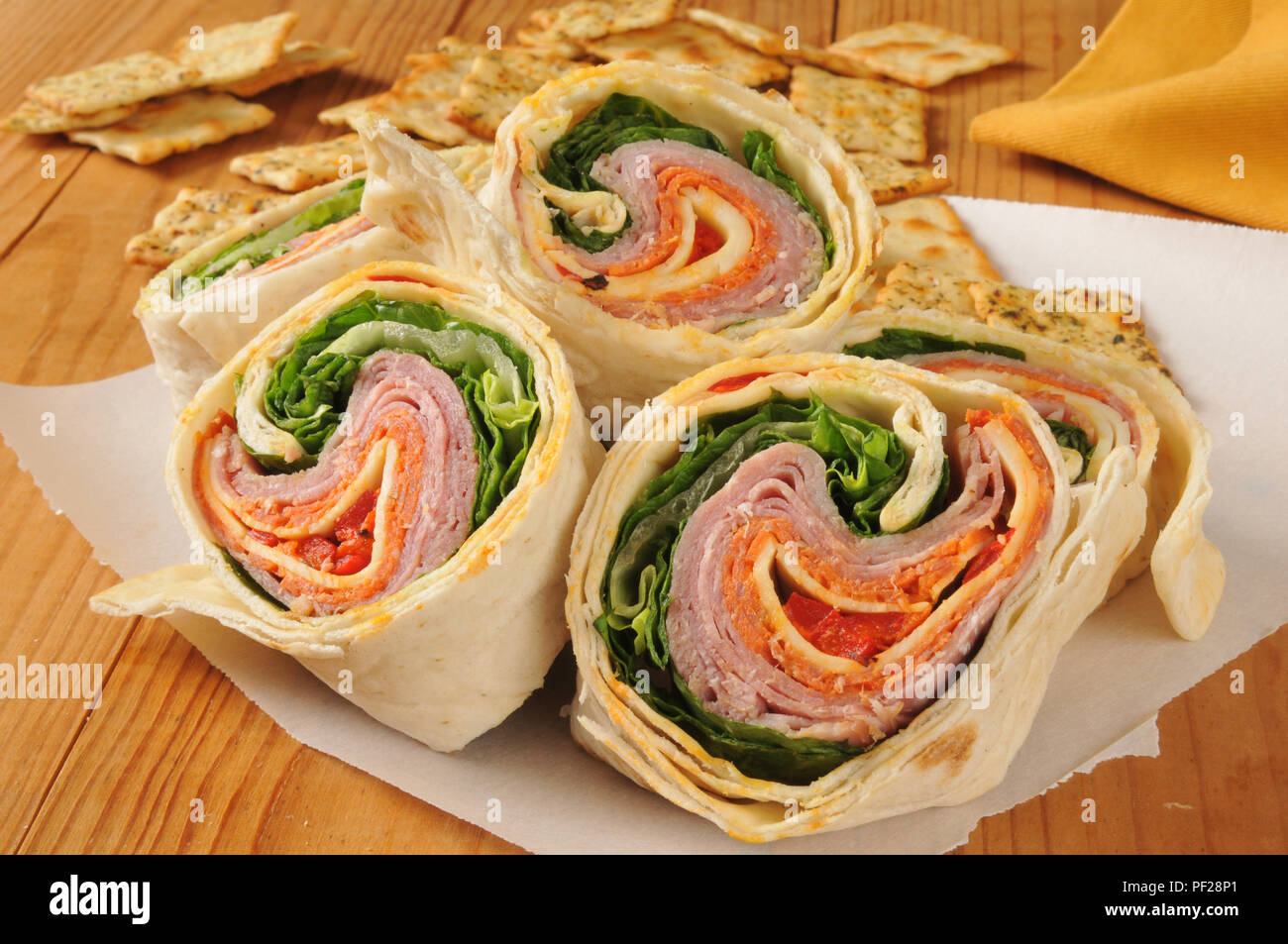 Closeup of an Italian meat wrap sandwich with flatbread crackers Stock