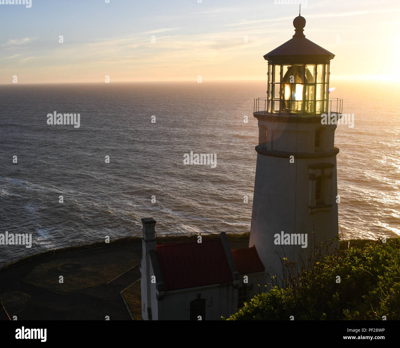 Heceta Head lighthouse between Florence and Yachats on the central Oregon coast at sunset. Stock Photo