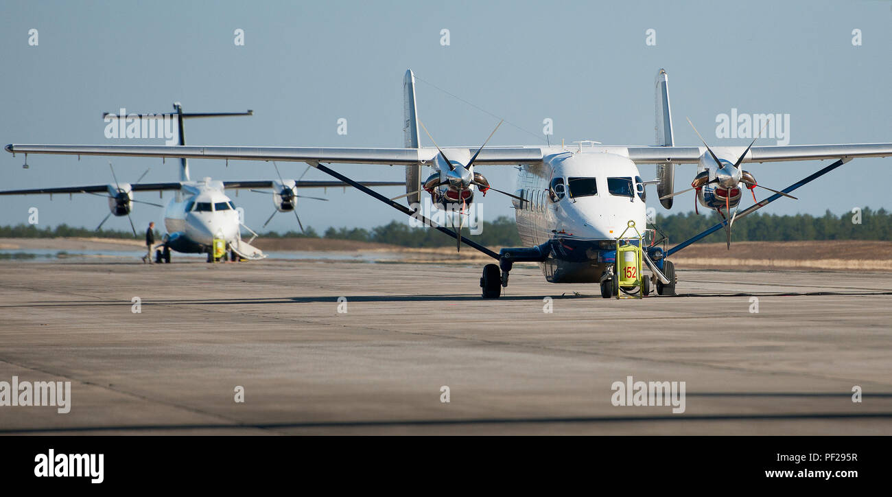 A C-145A Skytruck and a C-146A Wolfhound sit on the flightline waiting ...