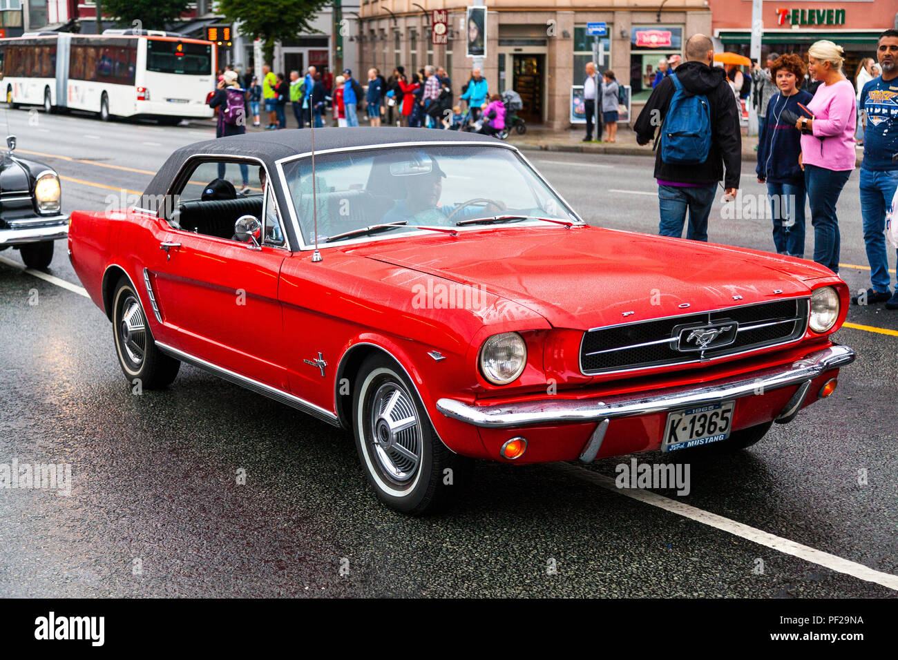 FORD MUSTANG, 1965 model, four seats, red. Classic cars parading ...