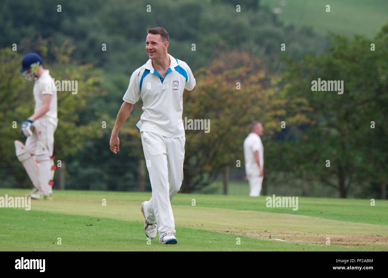 A bowler in a happy mood in a match between Chalesworth and Chisworth second eleven and Pott Shrigley second eleven. Stock Photo