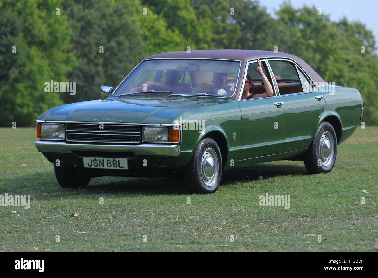 A classic Ford Cortina leaving a Classic Car Show at Temple Newsam in