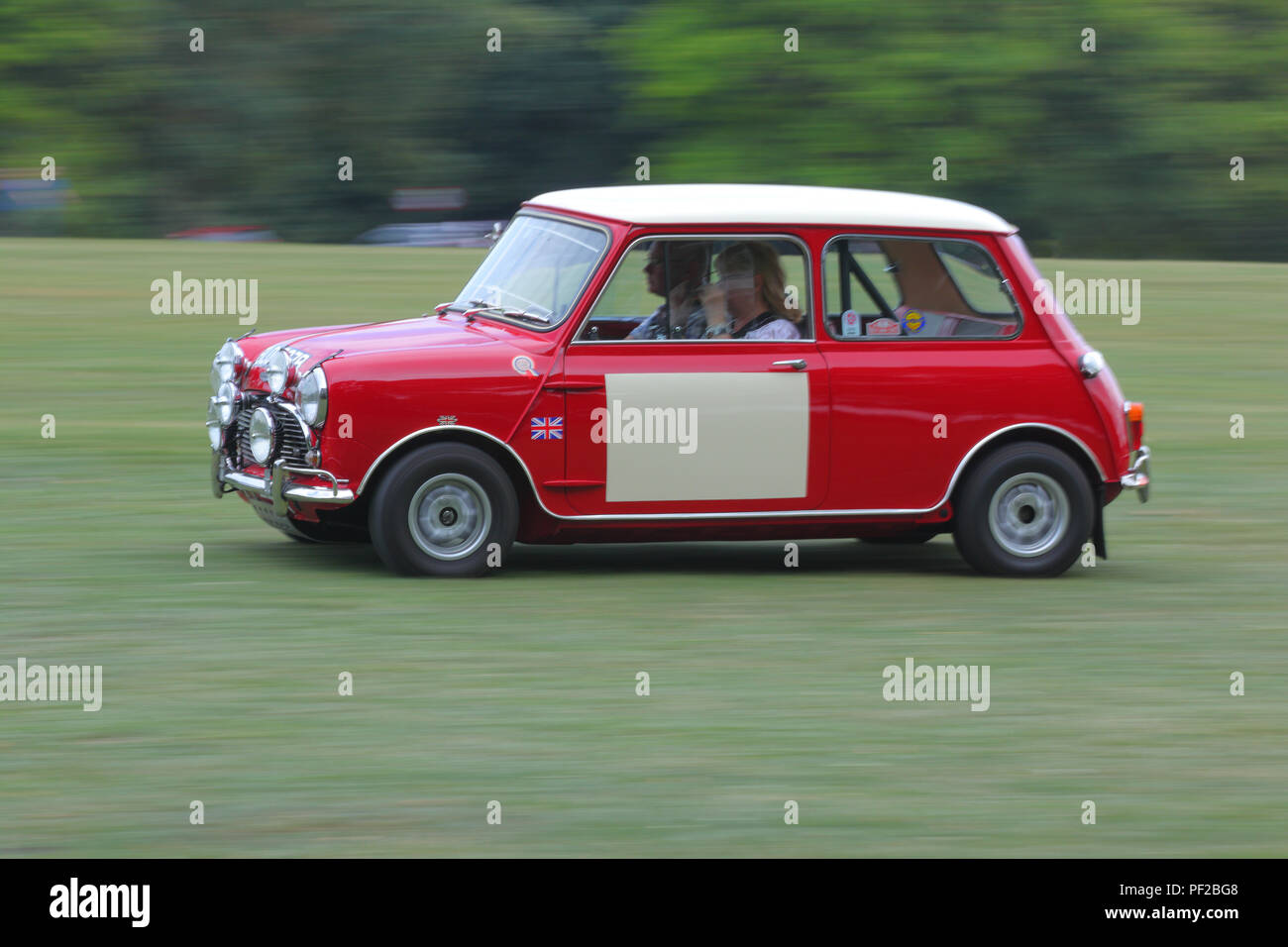 A classic mini leaving a Classic Car Show at Temple Newsam in Leeds