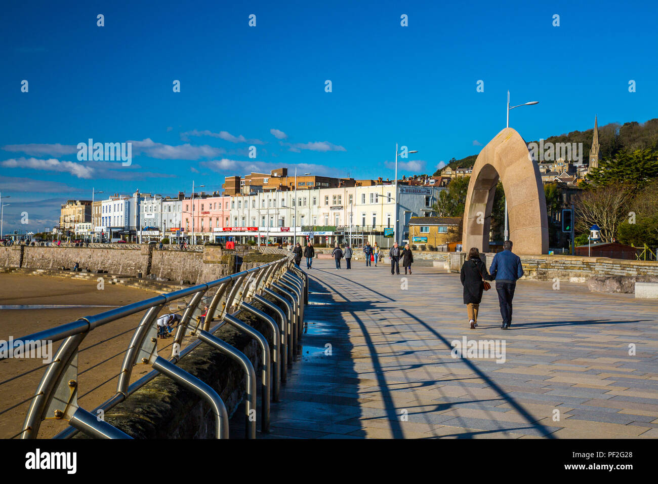 A granite archway and seafront hotels on the promenade in winter at Weston-super-Mare, North Somerset, England, UK Stock Photo