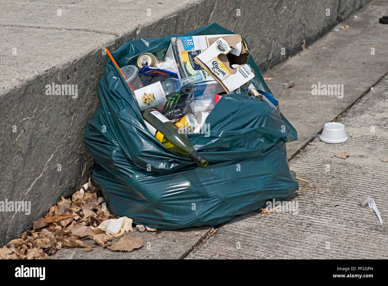 Waste management concept. Coastal pollution. Garbage on concrete