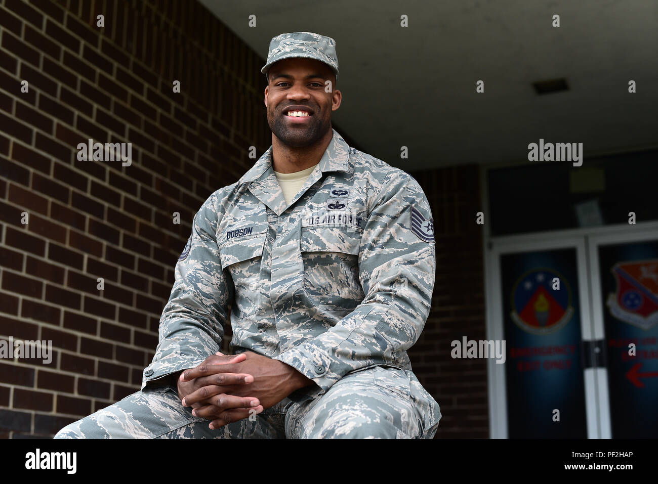 U.S. Air Force Tech. Sgt. Isaac M. Dobson sits outside the activities center where he trains to make his professional bodybuilding debut after placing 4th, 1st, and runner-up in recent competitions that earned him his Pro Card. Sergeant Dobson is a Security Forces specialist serving on a developmental duty assignment as an NCO Academy instructor at the Chief Master Sergeant Paul H. Lankford Enlisted Professional Military Education Center in East Tennessee. (U.S. Air National Guard photo/Master Sgt. Mike R. Smith) Stock Photo