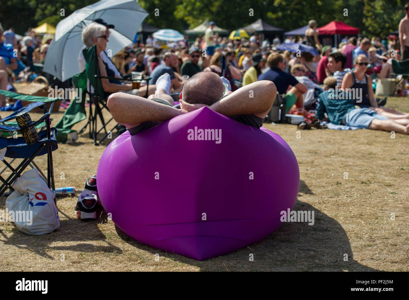 Crowds enjoying an open air music festival on a hot day in London Stock ...
