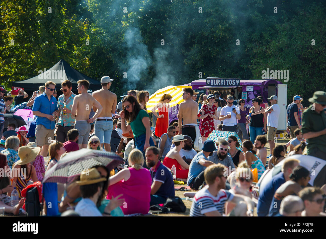 Crowds enjoying an open air music festival on a hot day in London Stock ...
