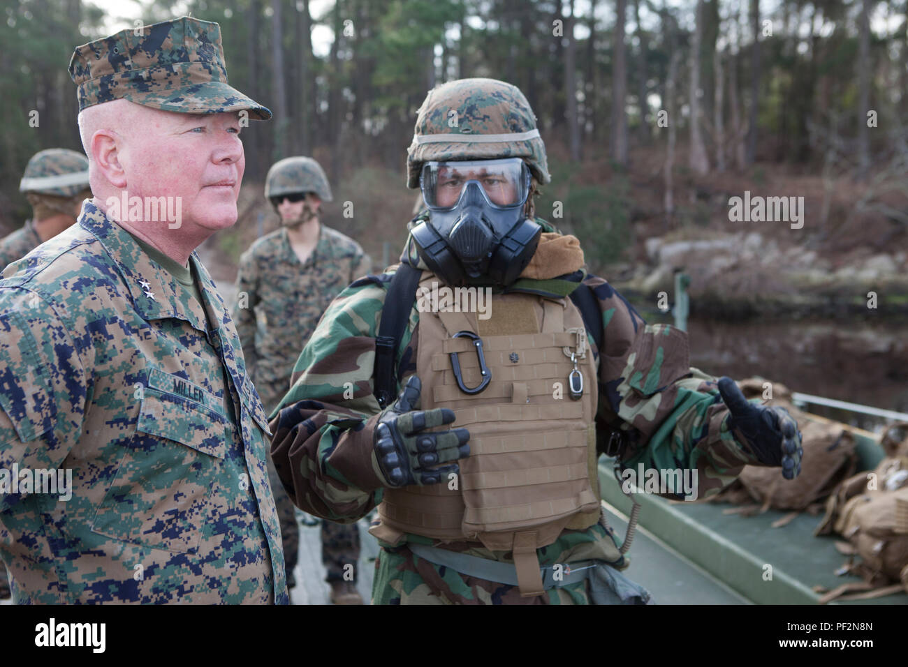 U.S. Marine Corps Maj. Gen. Walter L. Miller Jr., II Marine Expeditionary Force, commanding general, visits Marines with 2d Tank Battalion, 2d Marine Division, as they participate in the Iron Blitz Field Training Exercise on Camp Lejeune, N.C., Feb. 22, 2016. The exercise was conducted increase the Marines proficiency with the M1A1 Abrams tank in both offensive and defensive operations on unfamiliar terrain. (U.S. Marine Corps photo by Cpl. Alexander Hill, 2D MARDIV Combat Camera/Released) Stock Photo