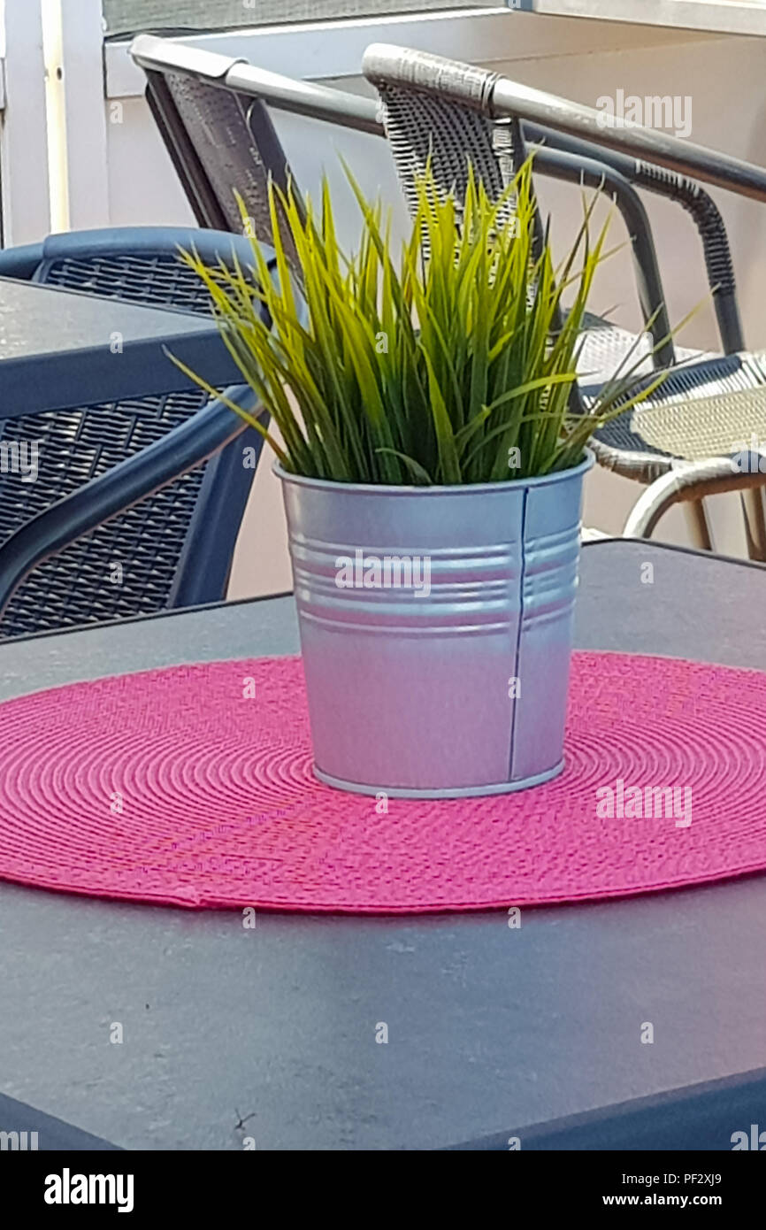 Flowerpot on a table in a coffee shop Stock Photo - Alamy