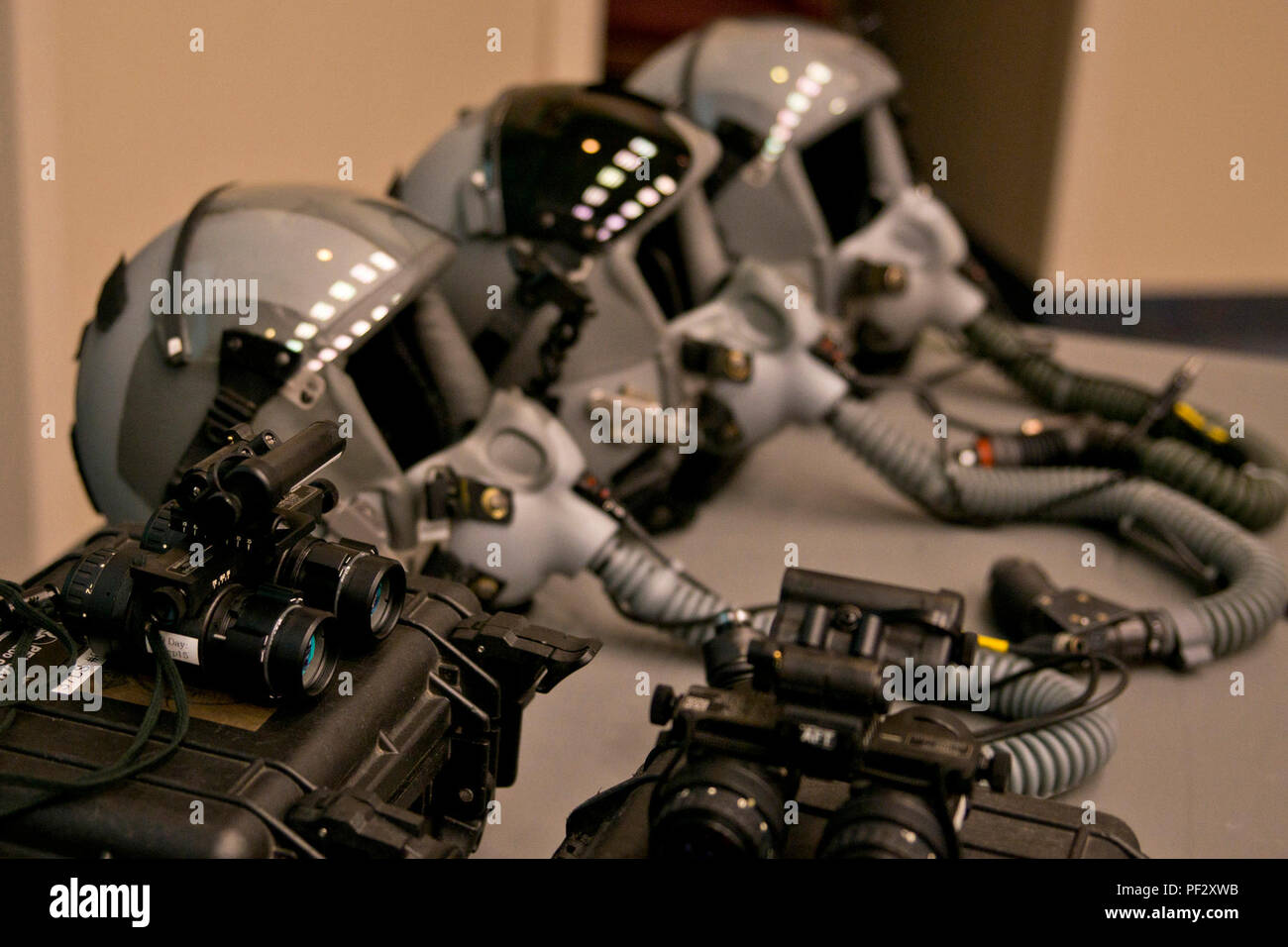 night-vision-equipment-and-helmets-used-by-c-130-aircrews-are-stacked-and-ready-for-attendees-of-a-c-130-mission-immersion-tour-at-little-rock-air-force-base-ark-feb-19-2016-night-vision-equipment-allows-c-130-pilots-of-the-ability-to-operate-in-a-wide-range-of-missions-or-land-almost-anywhere-in-the-world-both-day-and-night-us-air-force-photo-by-master-sgt-jeff-walstonreleased-PF2XWB.jpg