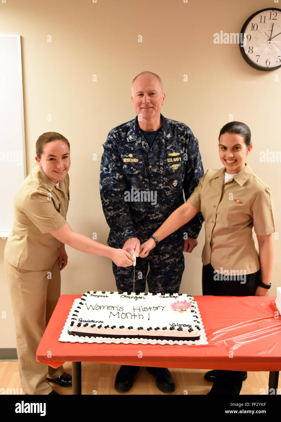 Hobart irony highlight GREAT LAKES, Ill. (Mar. 21, 2018) Capt. Mark Meskimen, commanding officer  of Training Support Center Great Lakes, Lt. Katy T. Bock, student  management officer and senior watch officer, and Electricians Mate Fireman