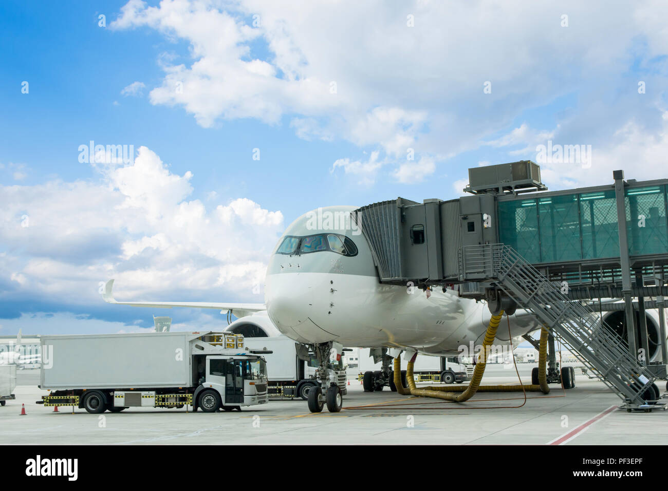 Loading cargo on plane in airport. cargo plane loading for logistic and  transport. view through window Passenger terminal Stock Photo - Alamy
