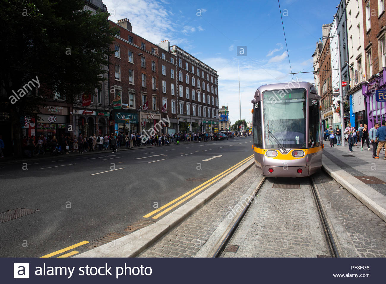 A Luas tram in Dublin's city centre on a sunny day in August as tourist numbers rise in Ireland. The Luas system has been a great success in Dublin Stock Photo