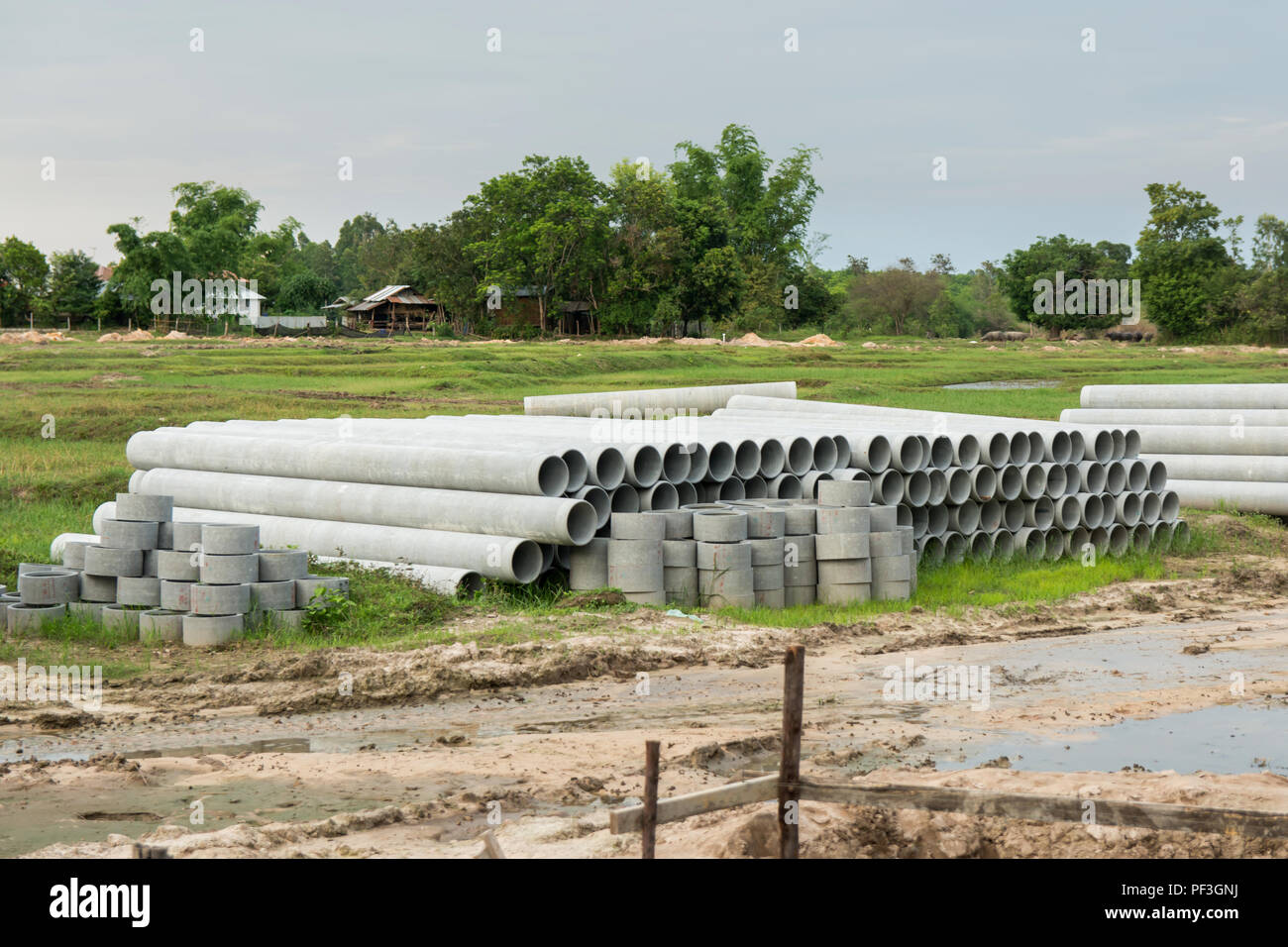 stacked of concrete, cement pipes. concrete pipes for irrigation at