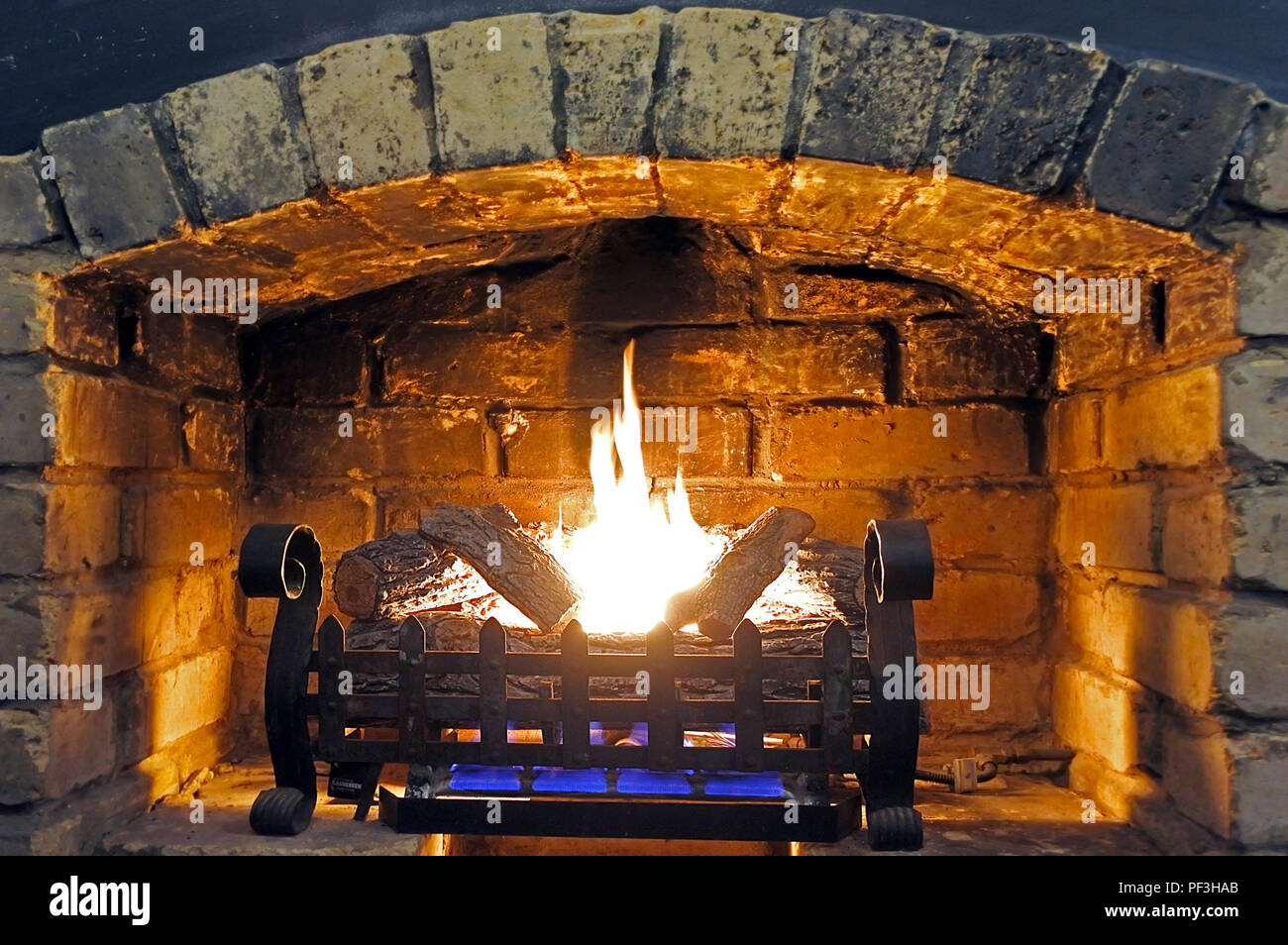 Image Of Open Fireplace And Wood Burning At Home On A Cold Winter