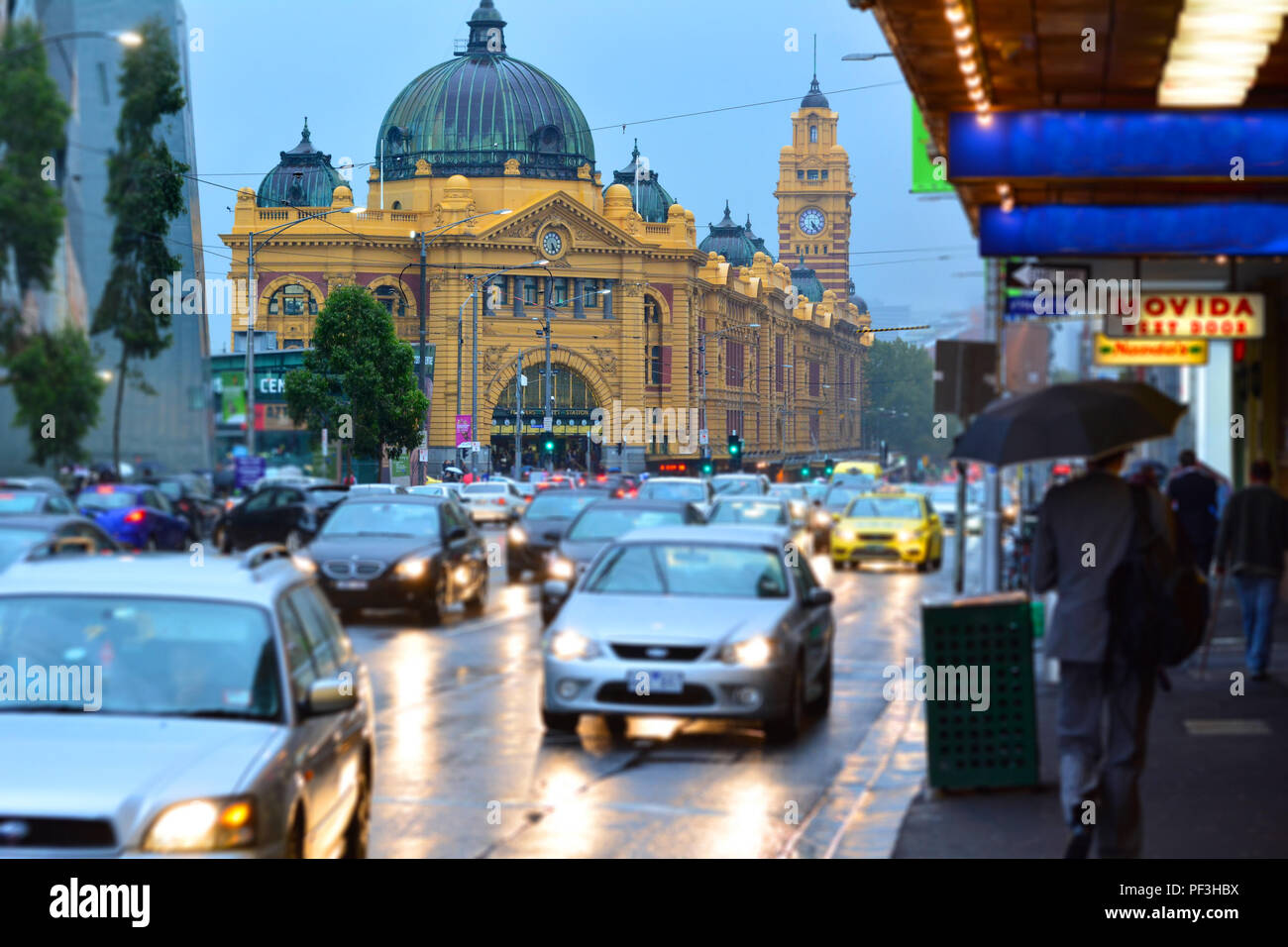 MELBOURNE, AUS - APR 1O 2014:Traffic outside Flinders Street Station.It was the first railway station in an Australian city and the world's busiest pa Stock Photo