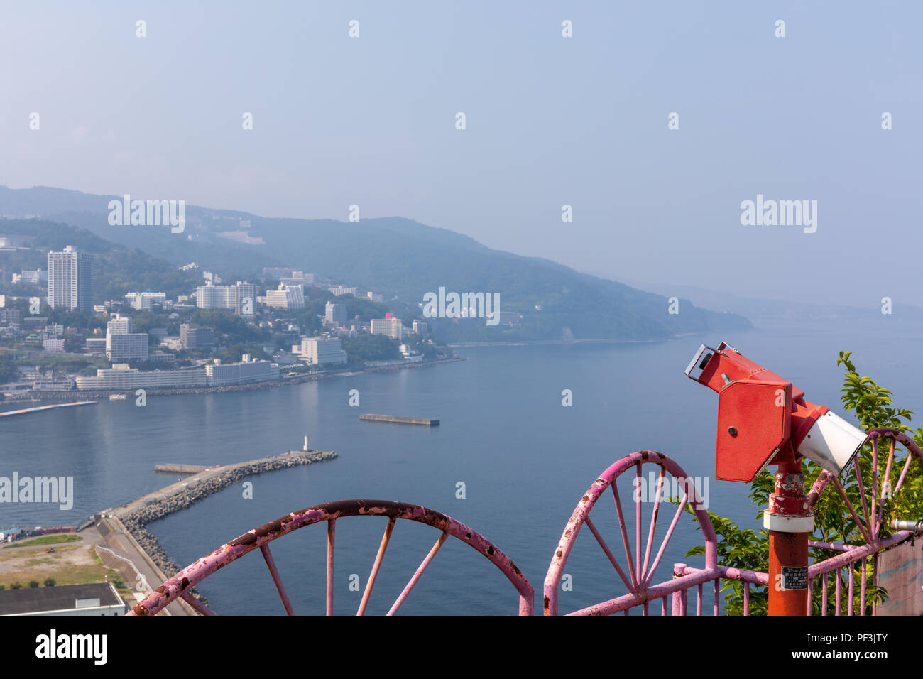 Coin-operated binoculars at vantage point overlooking the coast of Atami, Shizuoka Prefecture, Japan Stock Photo