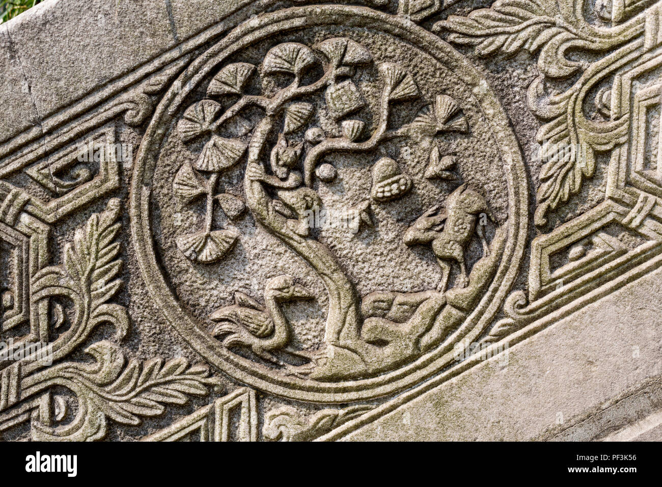 Yangzhou, Jiangsu, China.  Floral Motif Carved in Stone on Stairway Entrance to Graveyard of Puhaddin, 13th-century Muslim Missionary. Stock Photo
