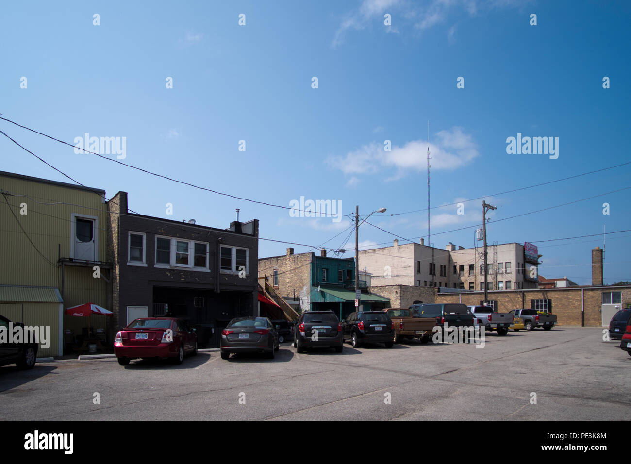 Back Alley and parking lot behind a row of retail businesses in
