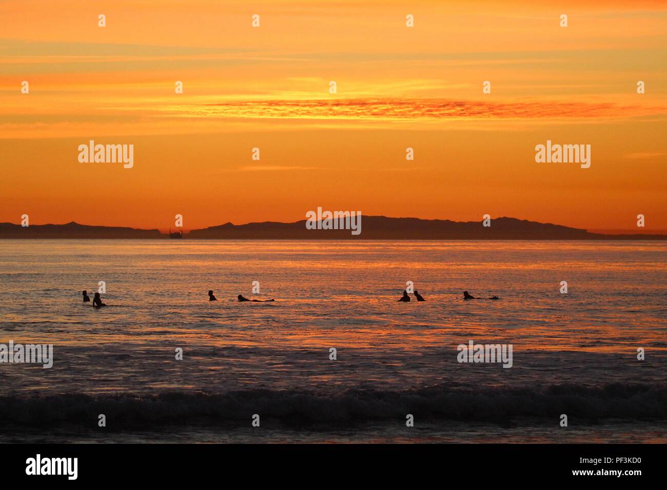 Sunset surfing in Huntington Beach California Stock Photo