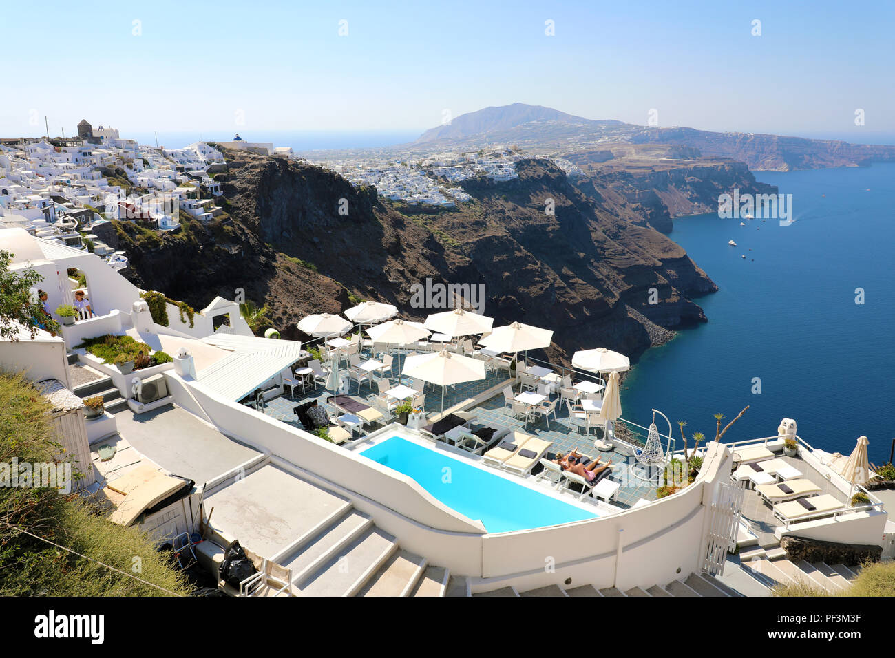 SANTORINI, GREECE - JULY 19, 2018: sunny morning view of Santorini Island. Picturesque summer sight of famous Greek luxury hotel resort Oia, Greece Stock Photo