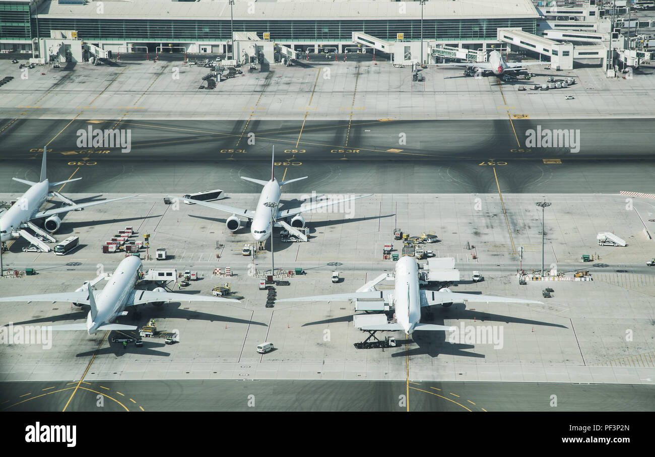 Aerial view of parked airplanes in the airport terminal. Modern and fastest mode of transportation. Stock Photo