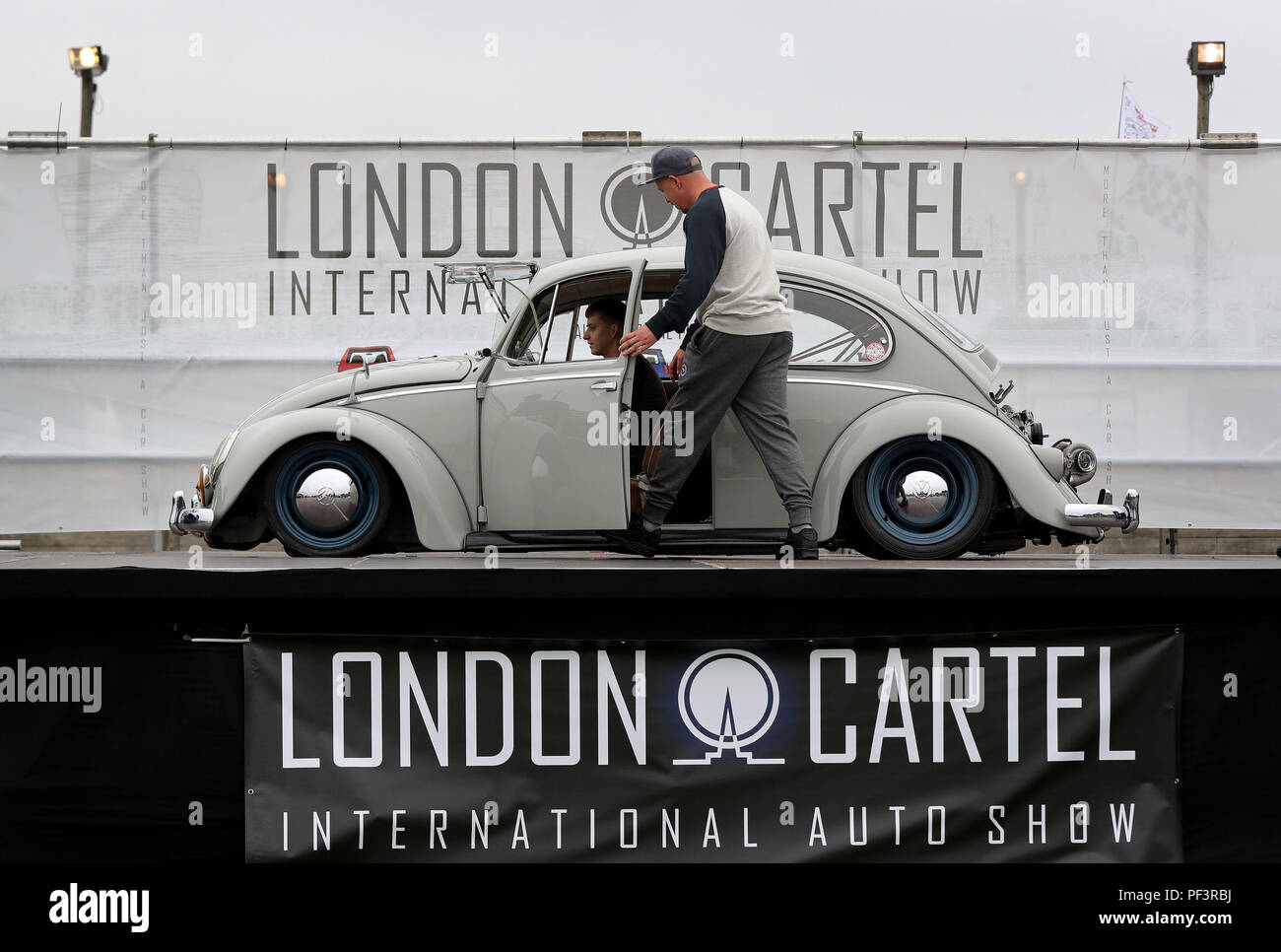 A Volkswagen Beetle on stage during the London Cartel International Auto Show, at the South of England Showground, West Sussex, where over 2000 classic and retro cars are being showcased. Stock Photo