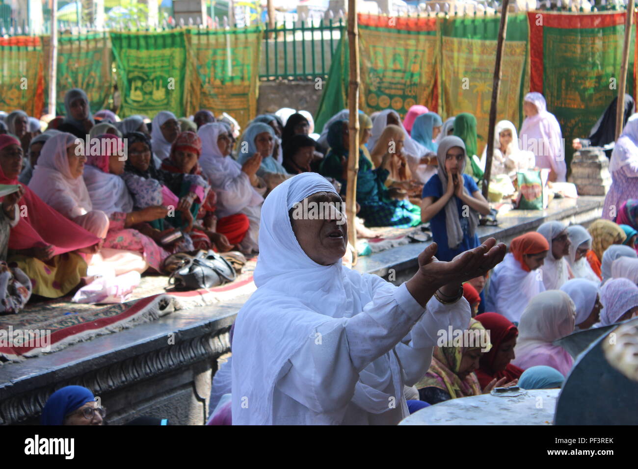 Srinagar, India. 18th Aug, 2018. After completing mid-day prayers inside the premises of Khanqah-e-Moula shrine on the eve of Urs Zain-Ul-Abdeen. Ghiyas-ud-Din Zain-ul-Abidin was the eighth sultan of Kashmir. He was known by his subjects, and indeed still is, as Bud Shah. Credit: Musaib Iqbal Bhat/Pacific Press/Alamy Live News Stock Photo