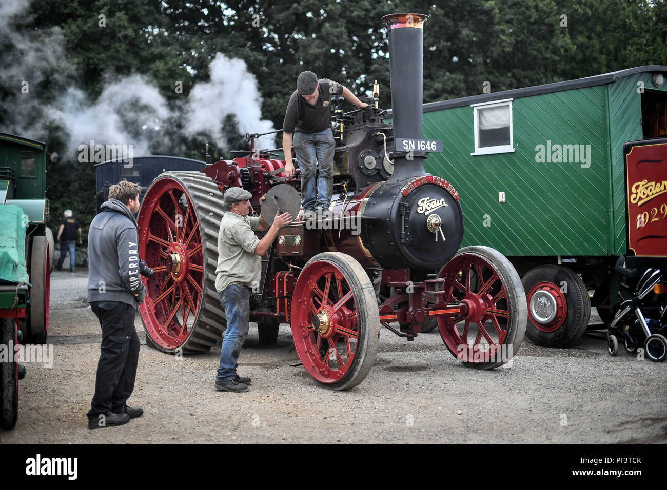 Steam enthusiasts prepare for the road as dozens of steam powered vehicles gather at a pub in Dorset prior to making their way to the Great Dorset Steam Fair, where hundreds of period steam traction engines and heavy mechanical equipment from all eras gather for the annual show on 23 to 27 August 2018, to celebrate 50 years. Stock Photo