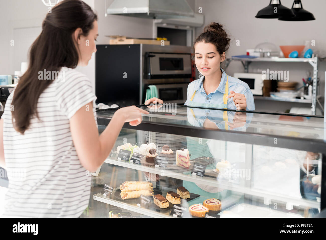 Young Woman Working in Cake Shop Stock Photo