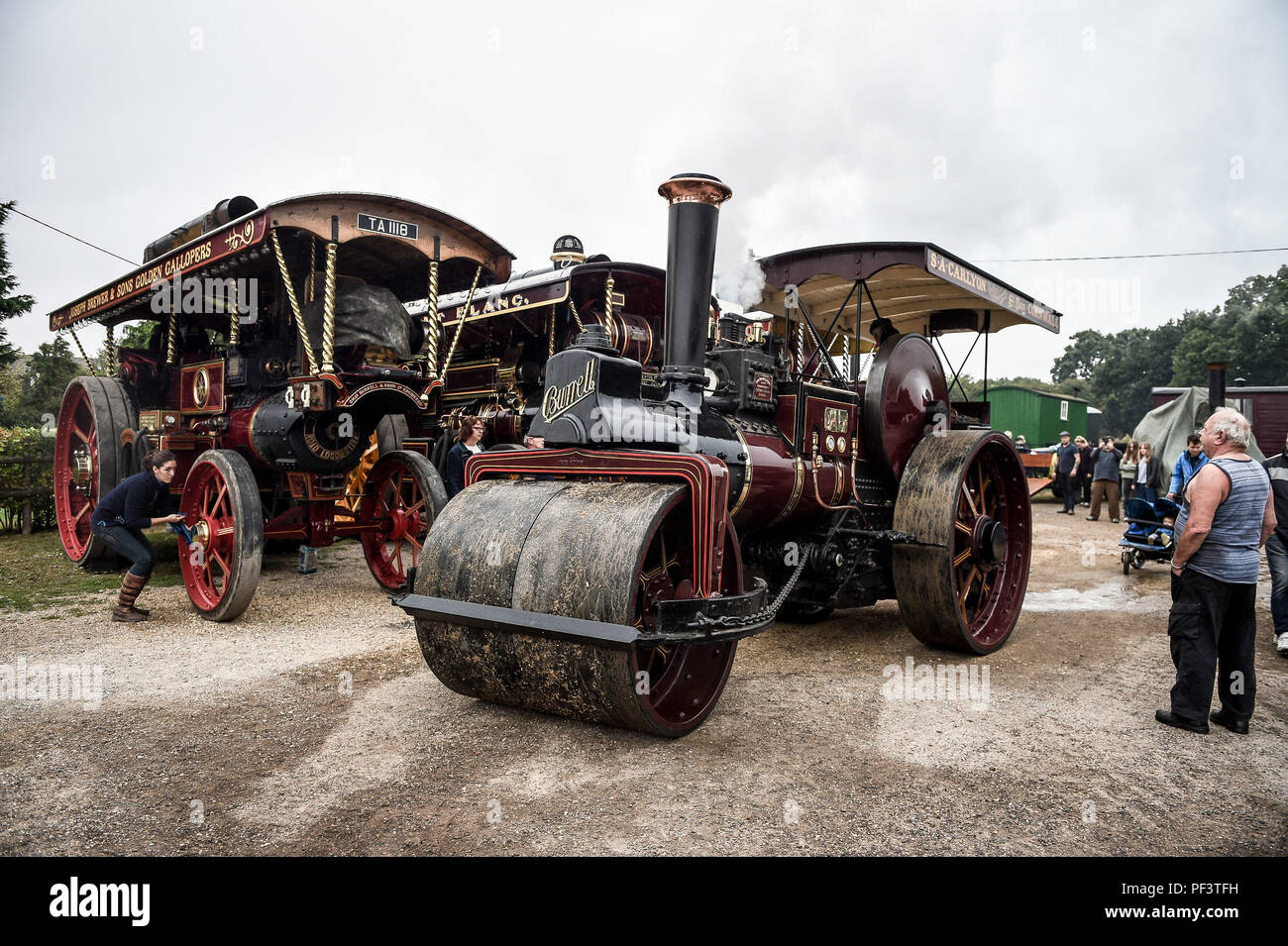 A Burrell Road Roller heads off after hundreds of steam enthusiasts gather at a pub in Dorset prior to making their way to the Great Dorset Steam Fair, where hundreds of period steam traction engines and heavy mechanical equipment from all eras gather for the annual show on 23 to 27 August 2018, to celebrate 50 years. Stock Photo
