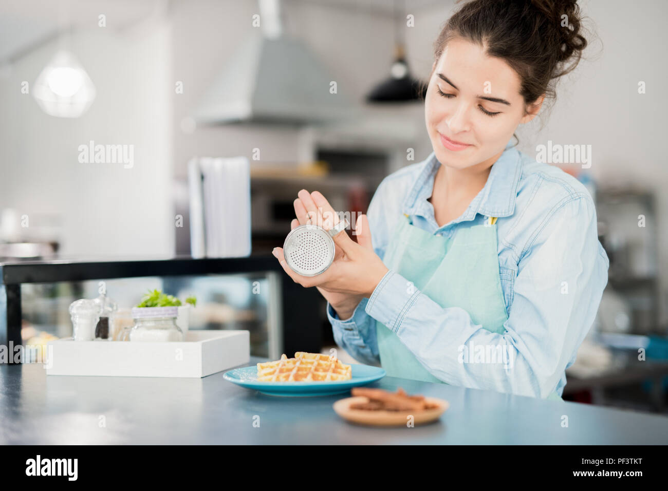 Waitress Finishing Dessert in Cafe Stock Photo