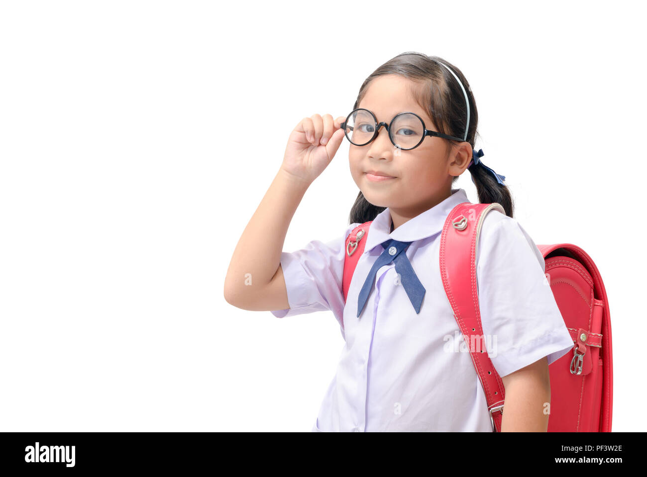 Happy little girl student wearing eyeglasses and schoolbag isolated on  white background, back to school concept Stock Photo - Alamy