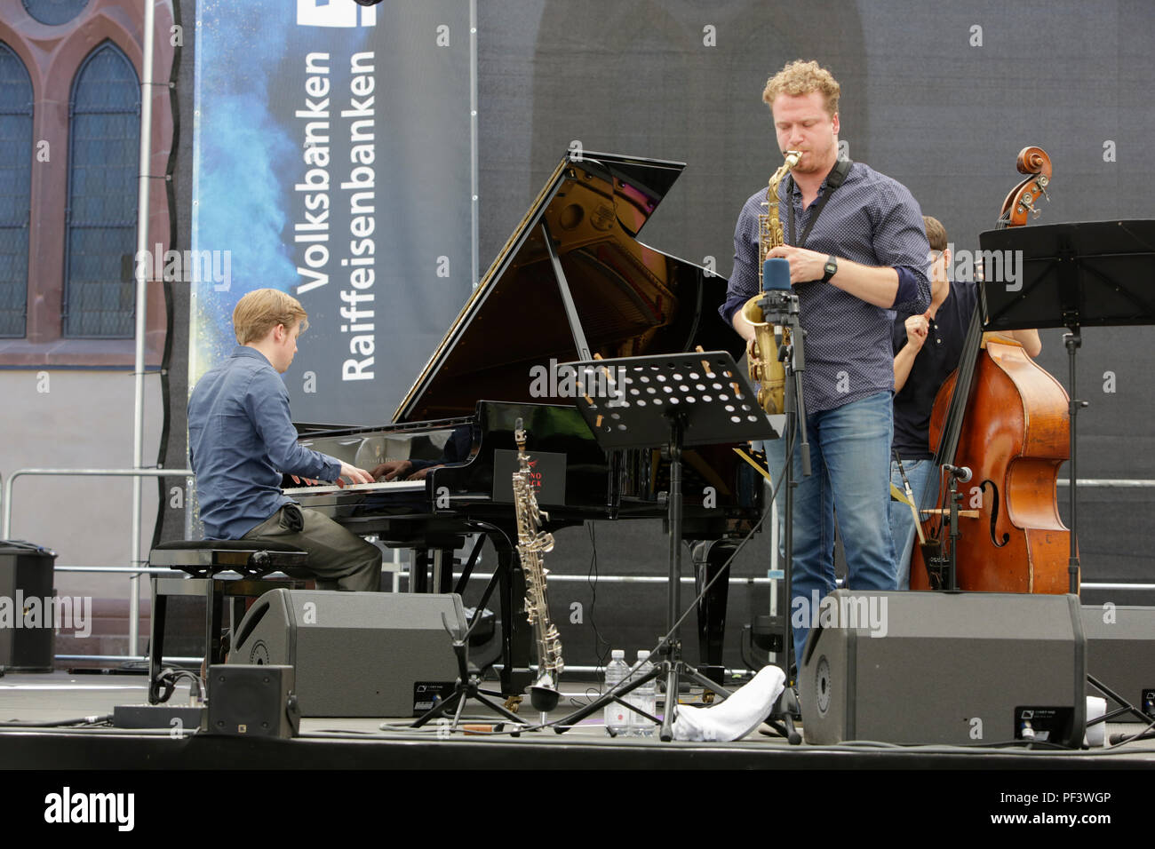 Worms, Germany. 18th Aug, 2018. Pianist Volker Engelbert, saxophonist Bastian Stein and bassist Arne Huber from the Volker Engelberth Quintett perform live on stage at the 2018 Jazz & Joy Festival in Worms in Germany. Credit: Michael Debets/Pacific Press/Alamy Live News Stock Photo