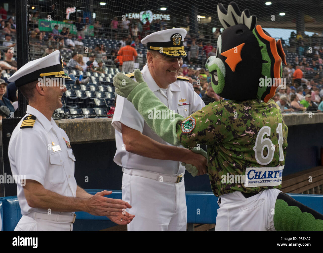 N Ru084 001 Norfolk Aug 11 18 Rear Admiral Chip Rock Commander Navy Region Mid Atlantic And Captain Kai Torkelson Commanding Officer Of Norfolk Naval Shipyard Meet Triton One Of The Norfolk Tides Mascots