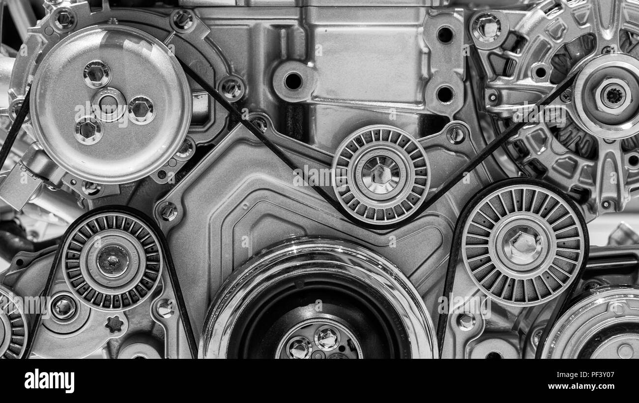 View on pulley and belts on a car engine. Stock Photo