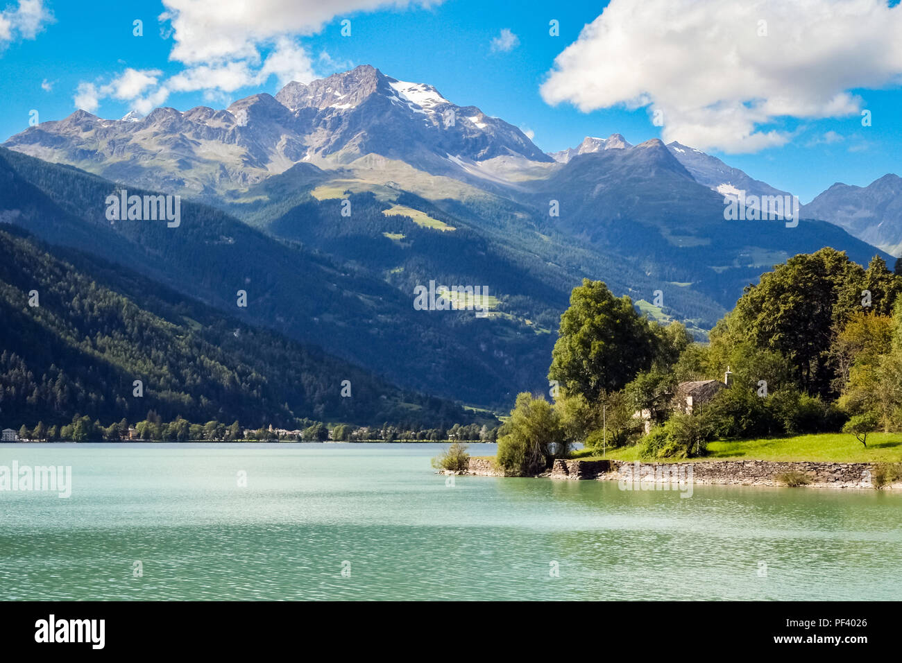 View on the lovely Lago di Poschiavo (Graubunden, Switzerland). Poschiavo is a municipality in the district of Bernina in the canton of Graubünden Stock Photo