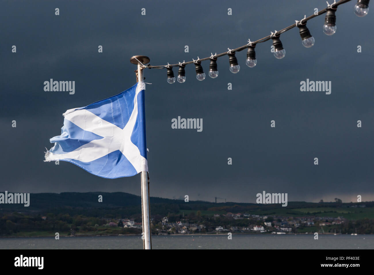 Scottish Flag against a Stormy Sky Stock Photo