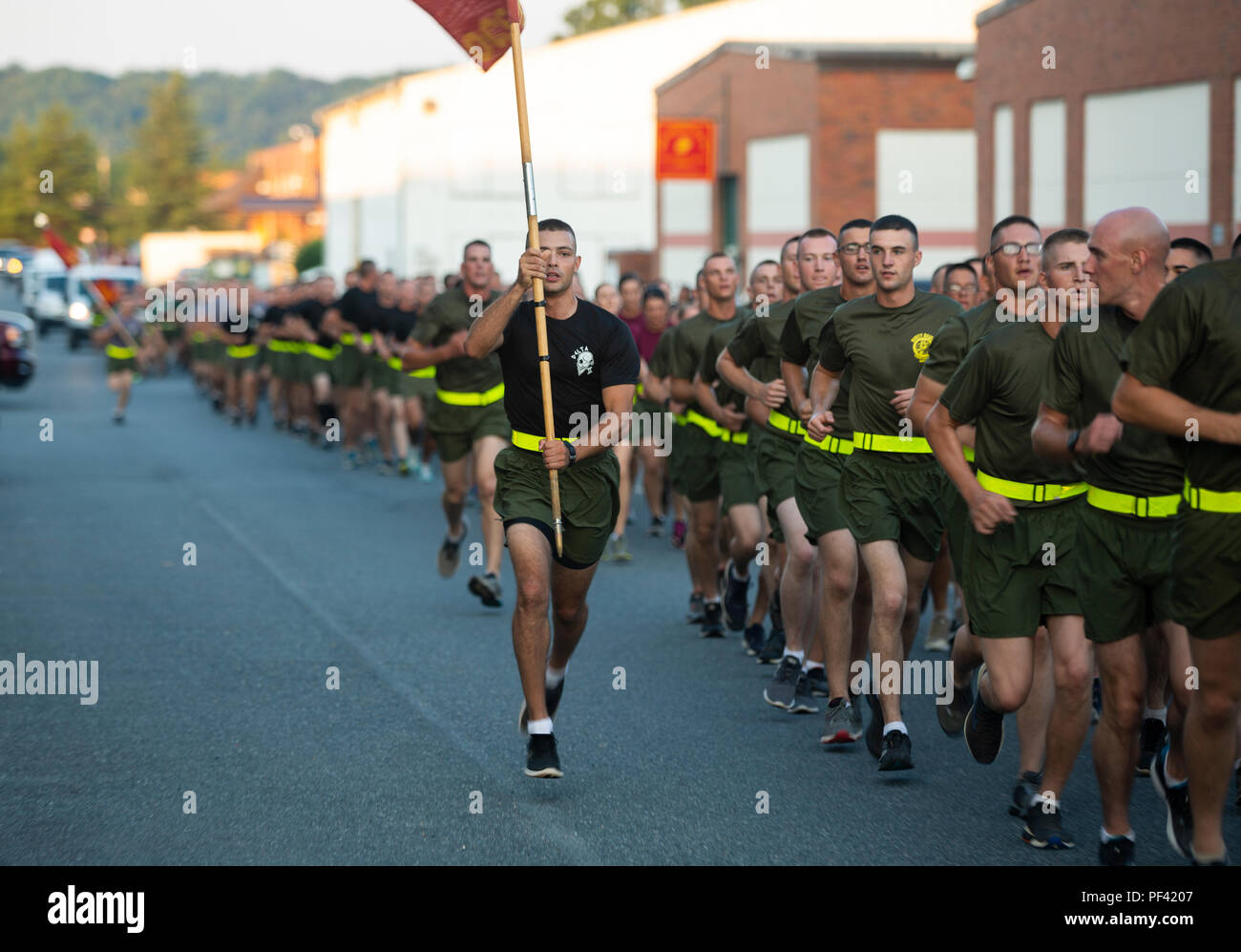 U.S. Marine Corps officer candidates with the Officer Candidates School and their families attend a Motivational Run on Marine Corps Base Quantico, Va., Aug. 10, 2018.The Run was part of the Officer Candidates School completion ceremony. (U.S. Marine Corps photo by Pfc. Yuritzy Gomez) Stock Photo