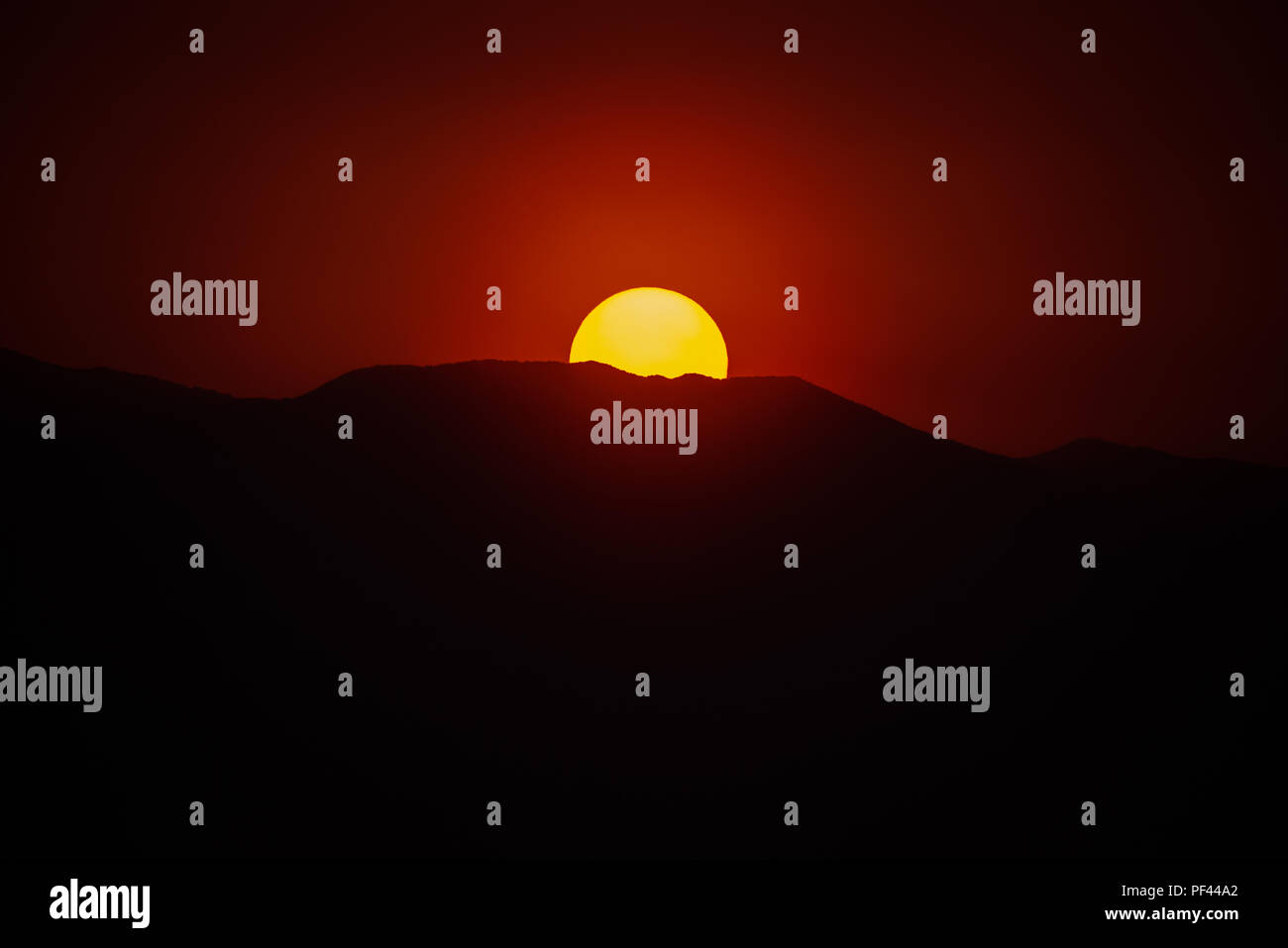 telephoto image of a smoky sunset with copy space Stock Photo