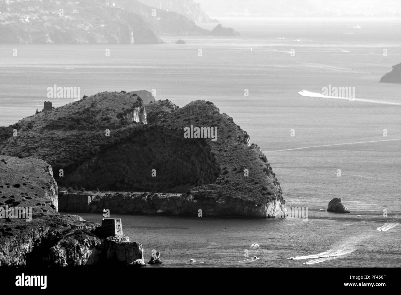 Beautiful aerial view of Capri island, with boat trails on the water